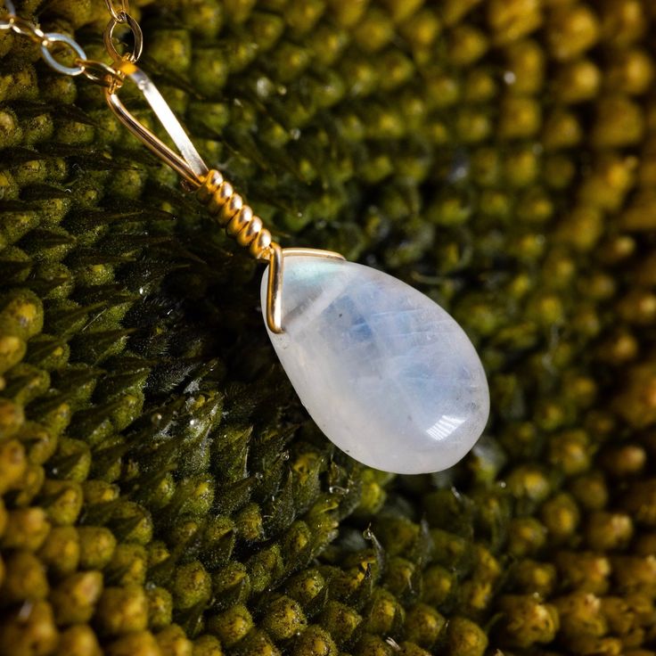 Our most classic style, this simple and dainty necklace is perfect for every day wear. Moonstone is a powerful feminine energy stone for growth and new beginnings. This crystal opens the mind and encourages lucid dreaming and serendipity. Our handcrafted necklaces and pendants are wrapped in 14k gold filled and sterling silver wire making them the perfect daily fashion choice for any lifestyle. This simple piece will help you glow for years to come, rain or shine. Kindness Gems donates 10% of ev Minimalist Gemstone Pendant Crystal Necklace, Delicate Everyday Crystal Necklace With Natural Stones, Delicate Crystal Necklace With Natural Stones For Everyday, Spiritual Jewelry With Moon Charm For Everyday, Spiritual Moon Charm Jewelry For Everyday, Everyday Spiritual Moon Charm Jewelry, Minimalist Gemstone Crystal Necklace For Healing, Minimalist Crystal Necklace With Round Gemstone Pendant, Minimalist Crystal Necklaces With Round Natural Stone Pendant