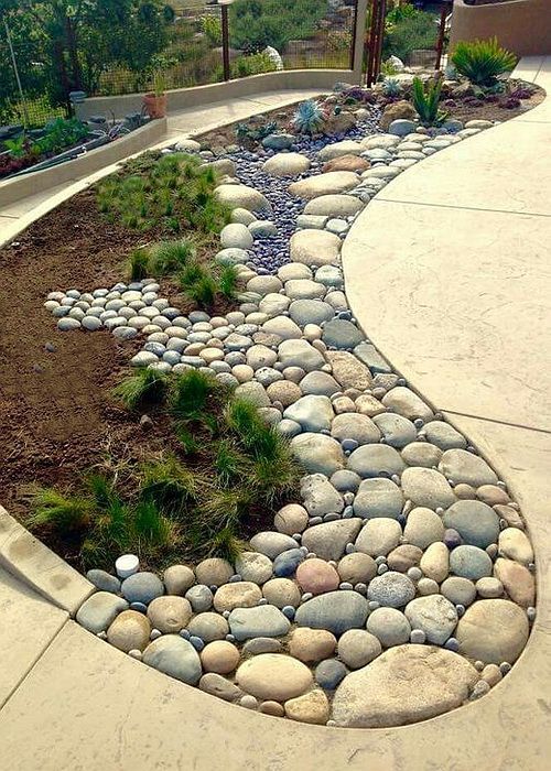 a walkway made out of rocks and gravel