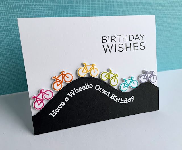 a birthday card with colorful bicycle pins on it's front and back, saying happy birthday wishes