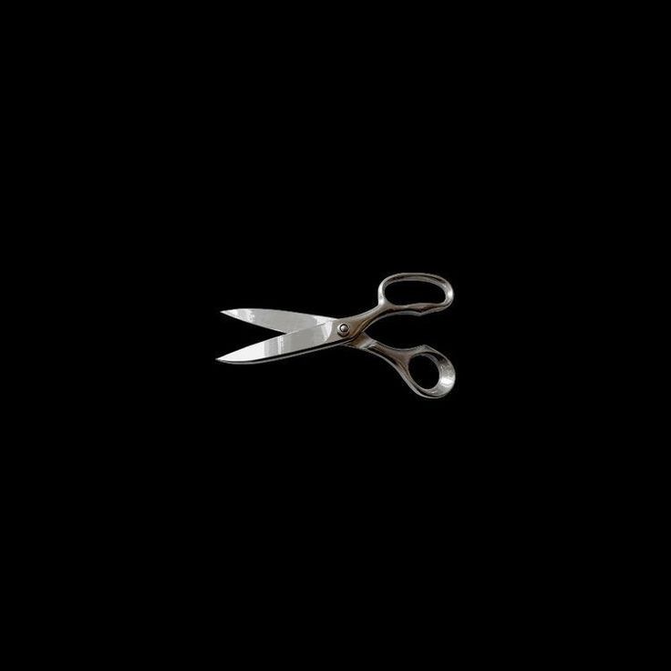 a pair of scissors on a black background