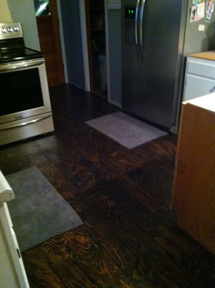 a stainless steel refrigerator and stove in a kitchen