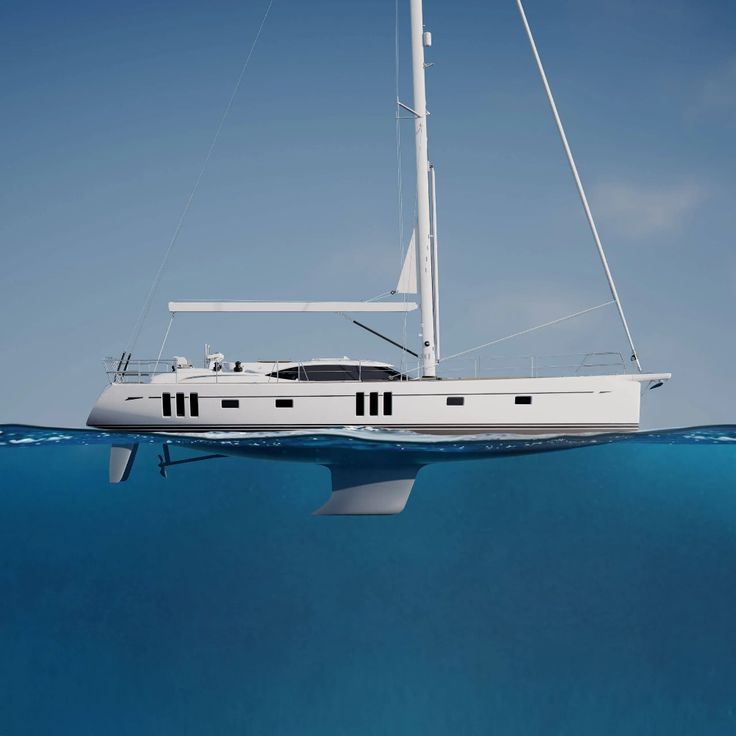 a white sailboat floating in the ocean with blue sky and water around it's edges