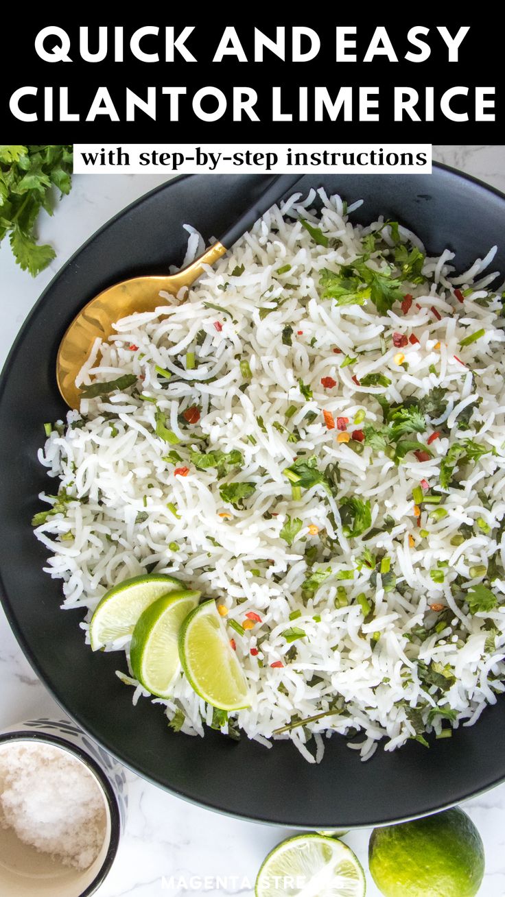 a black plate topped with rice and limes