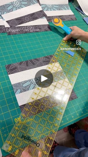 someone cutting up fabric with scissors on top of the quilts and making it look like they are going to cut