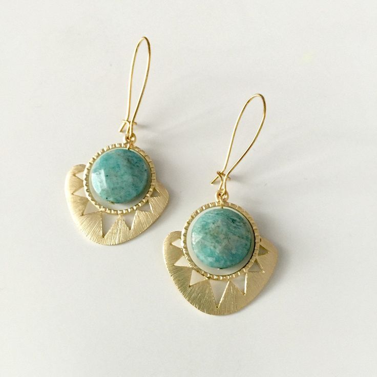 Beautiful Tribal Design with a stone center. Gold plated over brass. Available in coral, seafoam, navy blue and turquoise Blue Brass Earrings With Natural Stones, Blue Earrings With Natural Stones, Bohemian Amazonite Earrings As Gift, Bohemian Amazonite Earrings For Gifts, Bohemian Brass Earrings With Gemstone, Bohemian Brass Gemstone Earrings, Geometric Sun, Aztec Sun, Eye Earrings