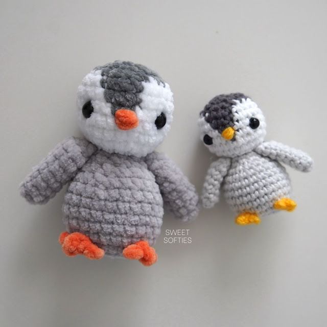 two small crocheted stuffed animals sitting next to each other