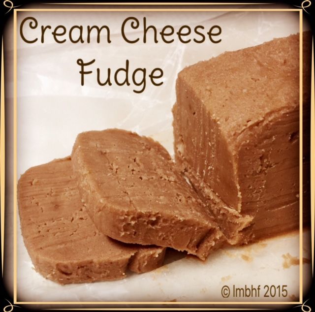 a close up of some food on a white surface with the words cream cheese fudge