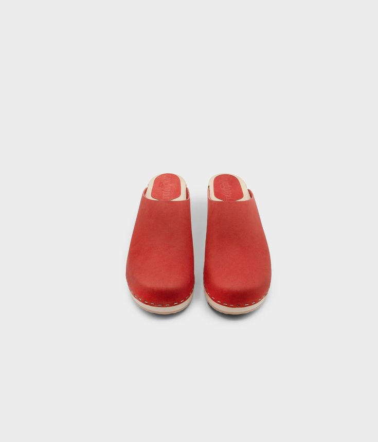 Elevate your everyday style with our minimalist clog mule, featuring clean lines and a timeless aesthetic that effortlessly transitions from day to night. Clog measurements:Heel height: 1 3/4” (4.5 cm)Toe height: 1 5/8″ (4.1 cm) Fit:RegularLeather:Nubuck leather Clogs consist of:Base: European Lime Wood Sole: Rubber sole Fastening: Staples Modern Clogs With Rubber Sole And Open Heel, Classic Slip-on Clogs With Rubber Sole, Clogs With Removable Insole And Round Toe, Modern Open Heel Clogs With Rubber Sole, Casual Mules With Contrasting Heel Counter, Modern Mules With Rubber Sole And Open Heel, Modern Mules With Open Heel And Rubber Sole, Classic Clogs With Leather Sole For Everyday, Clogs With Rubber Sole And Round Toe