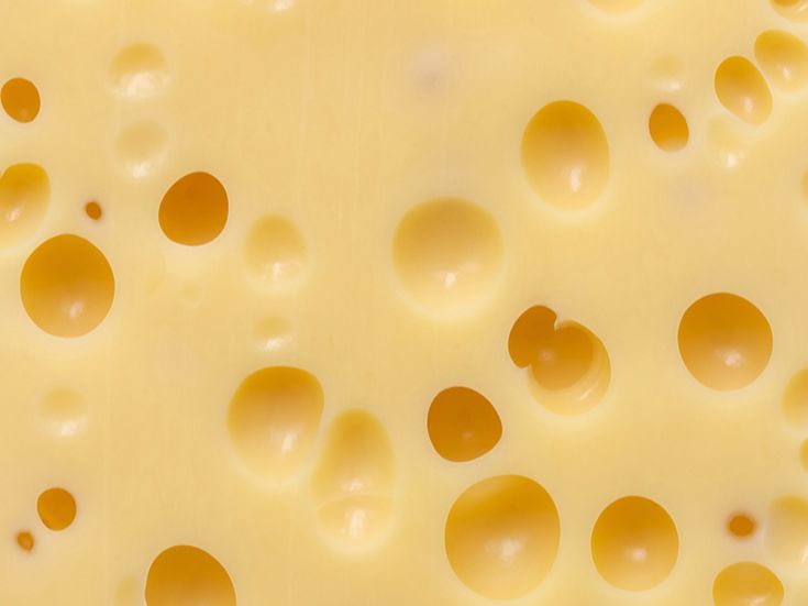 the cheese has many holes in it