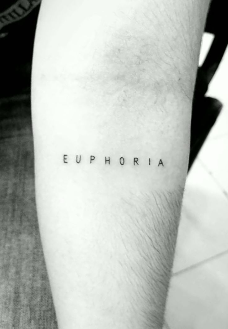 the word euphoria written in black ink on a person's leg