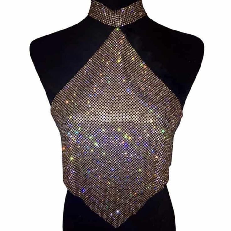 This Crystal Halter Top from Primadons and Donnas is a must-have for any wardrobe. The top features a choker with all stones, giving it a unique and eye-catching look. The top is made from all crystal, making it a luxurious and stylish piece. This top is perfect for any occasion, from a night out with friends to a formal event. It's sure to make a statement and turn heads wherever you go. With its timeless design, this top is sure to be a staple in your wardrobe for years to come. Head to Primad Mesh Outfit, Chainmail Top, Cowl Top, Club Outfits For Women, Glam Tops, Diamond Bling, Rhinestone Top, Crystal Diamond, Womens Cami