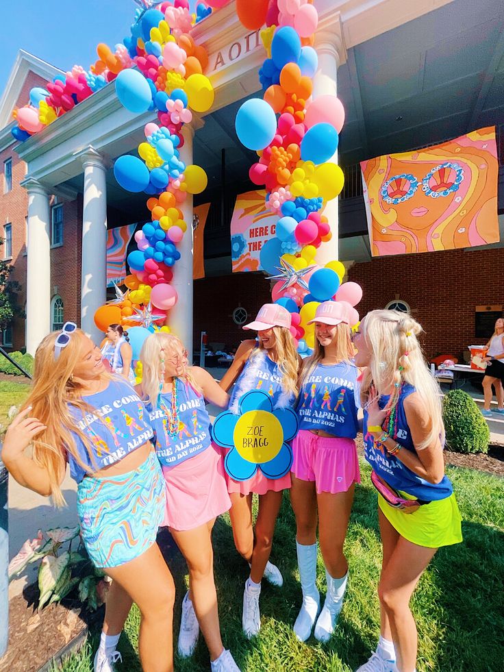 the girls are all dressed up and having fun at the birthday party with their balloons