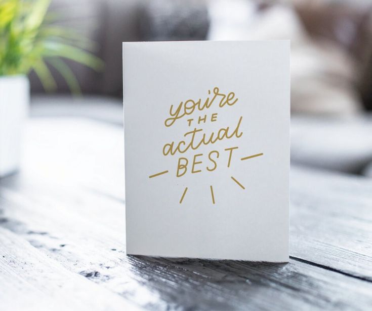 a card that says you're the actual best on it sitting on a table