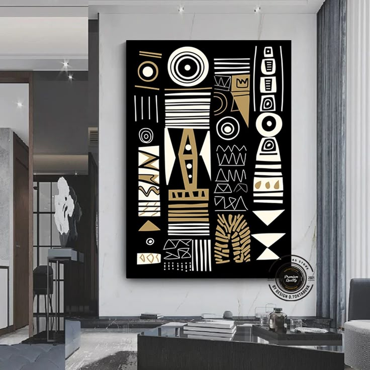 a black and gold abstract painting in a living room