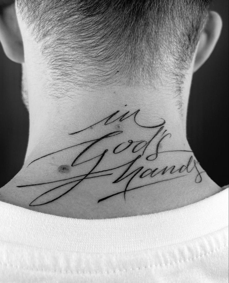 the back of a man's neck with his handwriting on it