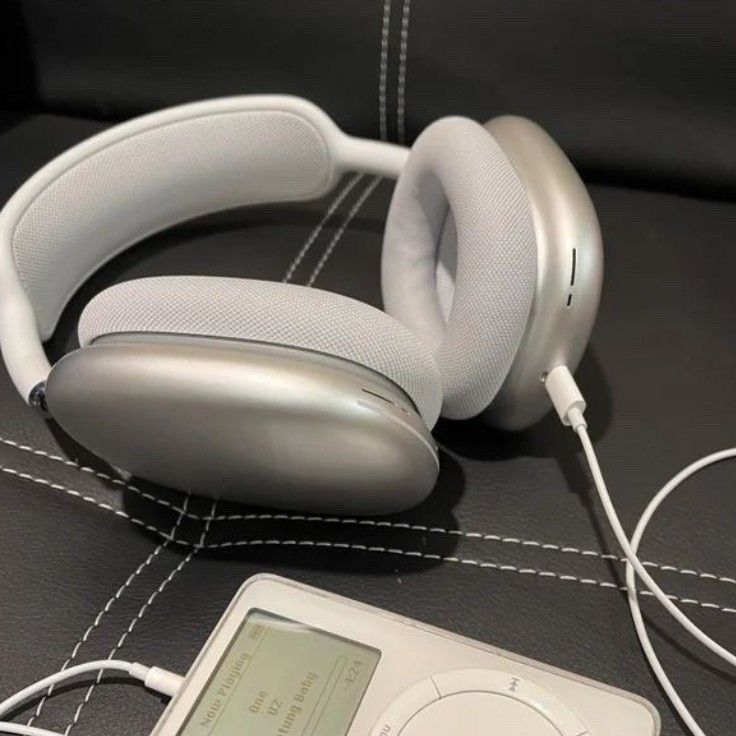 an ipod and headphones sitting on top of a table