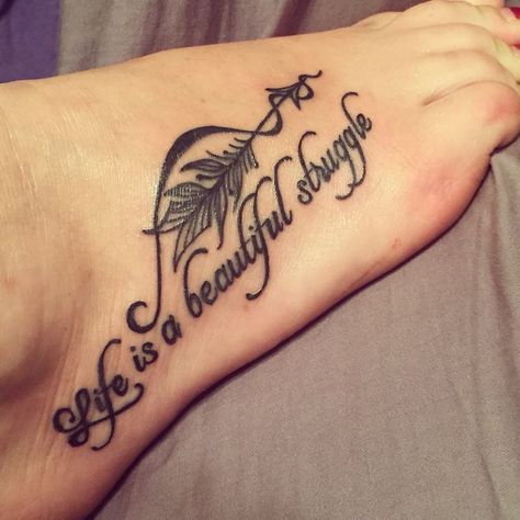 a woman's foot with a tattoo saying life is a beautiful struggle on it