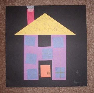 a child's drawing of a house made out of construction paper