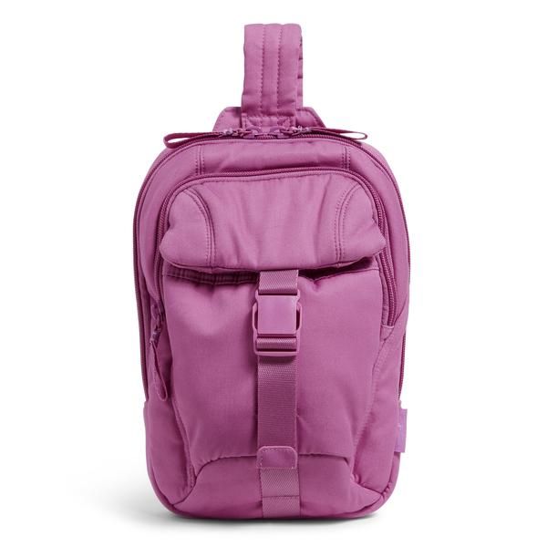 a pink backpack with straps on the front and side pockets, sitting against a white background