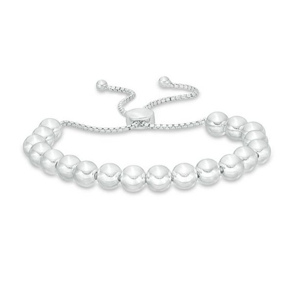 Dress her wrist in the luxury of this beaded bolo bracelet. Crafted in sterling silver, this shimmering design features a bright row of high-polish beads. She can wear one, two or more to create a look all her own. Buffed to a brilliant luster, this easy-on box chain bracelet adjusts up to 9.0 inches in length and secures with a bolo clasp and ball ends. Adjustable Silver Tennis Bracelet For Everyday, Adjustable Polished Beads Sterling Silver Bracelet, Adjustable Silver Sterling Tennis Bracelet, Adjustable Silver Sterling Silver Tennis Bracelet, Classic Adjustable Sterling Silver Bracelet With Polished Beads, Classic Adjustable Beaded Bracelets With Silver Beads, Resizable Silver Beaded Bracelets, Elegant Beaded Bracelets With Sliding Knot, Sterling Silver Beaded Bracelets With Polished Beads