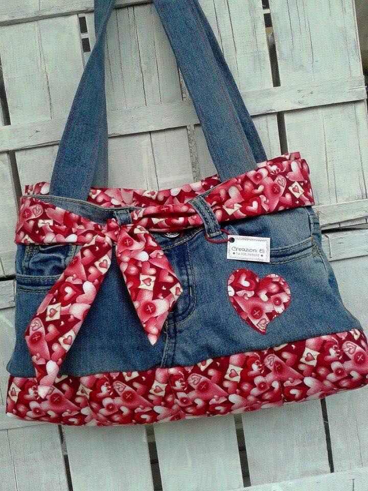 the purse is made from an old pair of jeans and has a bow on it