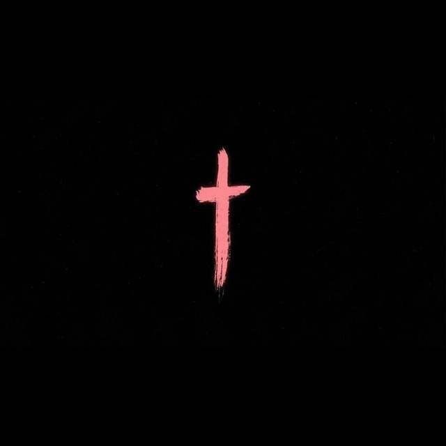 a pink cross on a black background