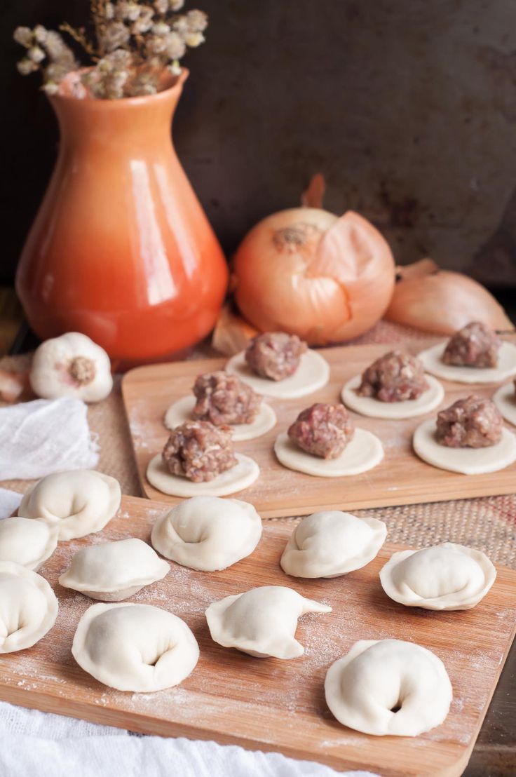 the doughnuts are ready to be baked on the cutting board and put in the oven