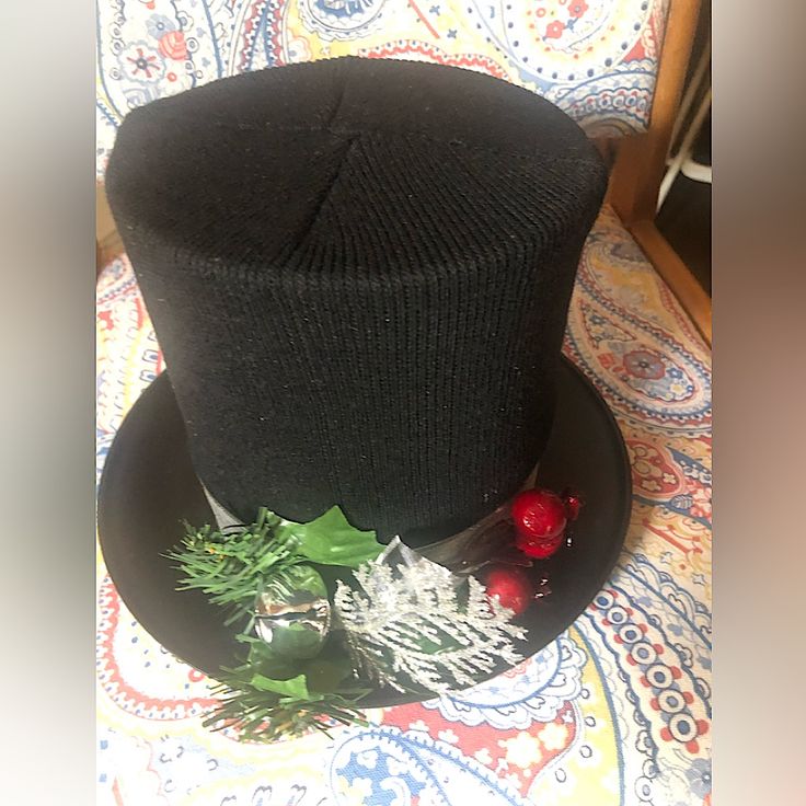 a black top hat sitting on top of a table