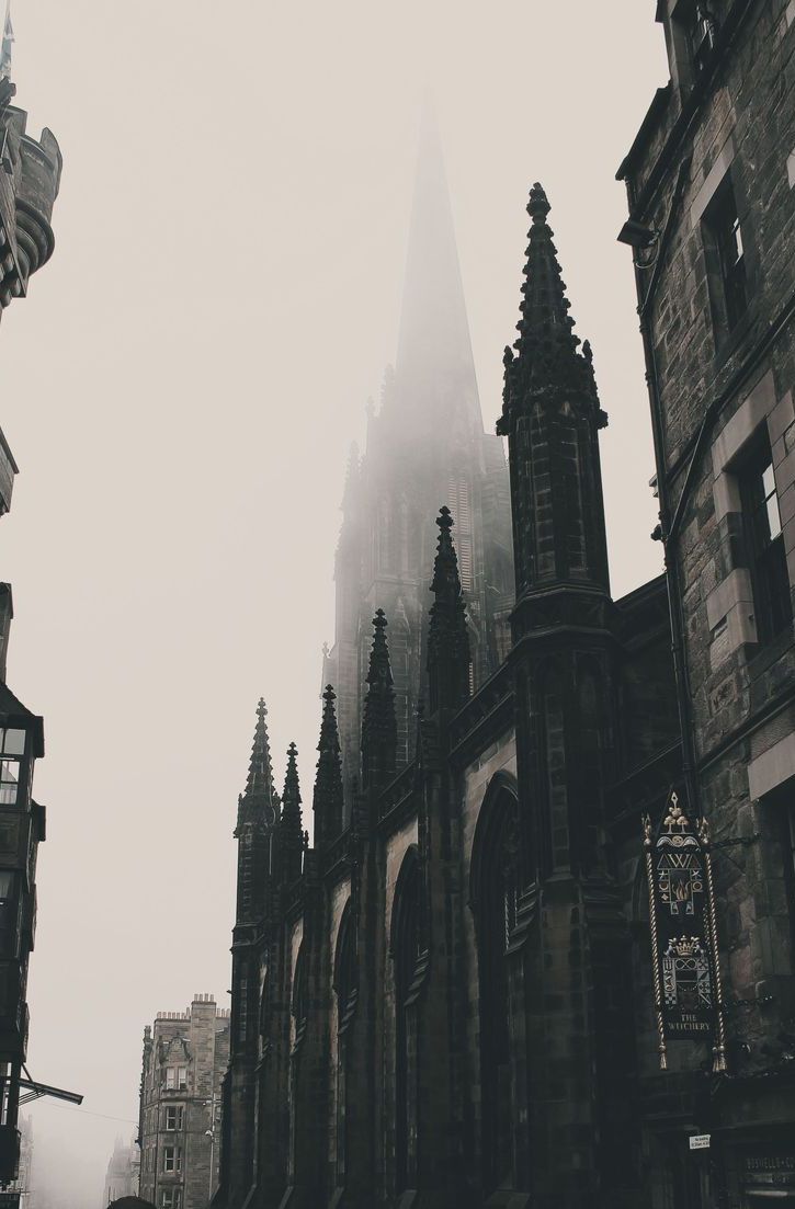 an old gothic church in the foggy city