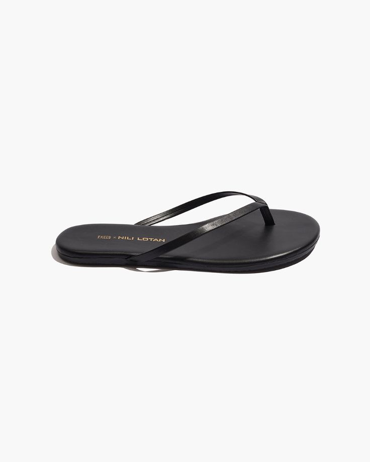 Slip on sandal in matte napa luxury calfskin leather. Made in Brazil. Classic Leather Flip Flops For Spring, Modern Leather Flip Flops With Leather Footbed, Modern Black Toe Post Sandals, Sleek Calf Leather Sandals With Leather Sole, Black Calf Leather Sandals With Leather Footbed, Classic Black Sandals With Open Heel, Sleek Sandals With Single Toe Strap, Sleek Open Toe Calf Leather Sandals, Sleek Black Calf Leather Sandals