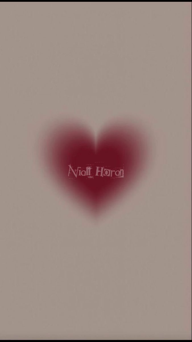 a red heart with the word noel horan written on it's left side