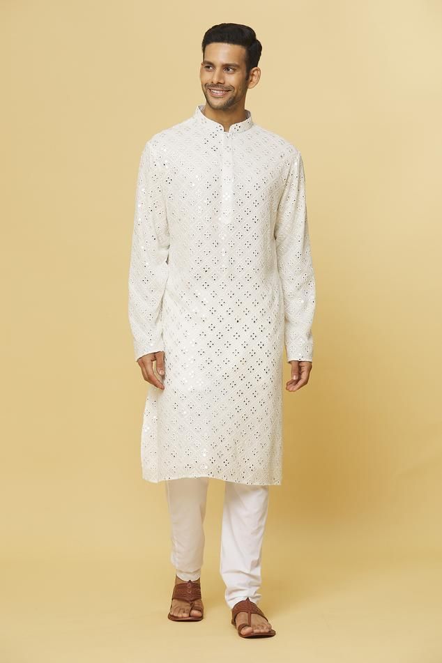 White kurta with mirror embroidery and side slits. Paired with pyjama.
Components: 2
Pattern: Embroidered
Type Of Work: Mirror
Neckline: Mandarin collar
Sleeve Type: Full
Fabric: Cotton
Color: White
Other Details: 
Concealed placket detailing
Slits
Occasion: Mehendi and Puja - Aza Fashions Festive Semi-stitched Cutwork Kurta, Unstitched Long Sleeve Cutwork Kurta, Straight Kurta With Cutwork For Navratri, Eid Cotton Salwar Kameez With Cutwork, Cutwork Straight Kurta For Navratri, Straight Cutwork Kurta For Navratri, Long Sleeve Kurta With Cutwork For Eid, Festive Straight Kurta With Cutwork, Unstitched Traditional Cutwork Kurta