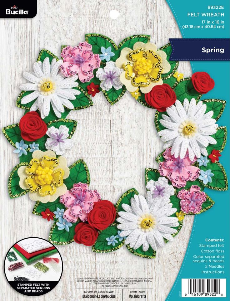 the crafter's workshop felt wreath kit is shown with flowers and leaves on it