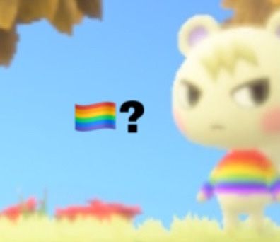 an animal with a rainbow shirt standing next to a tree