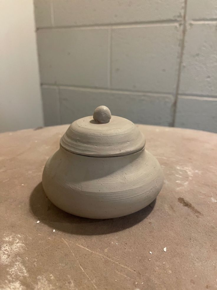 a clay pot sitting on top of a table