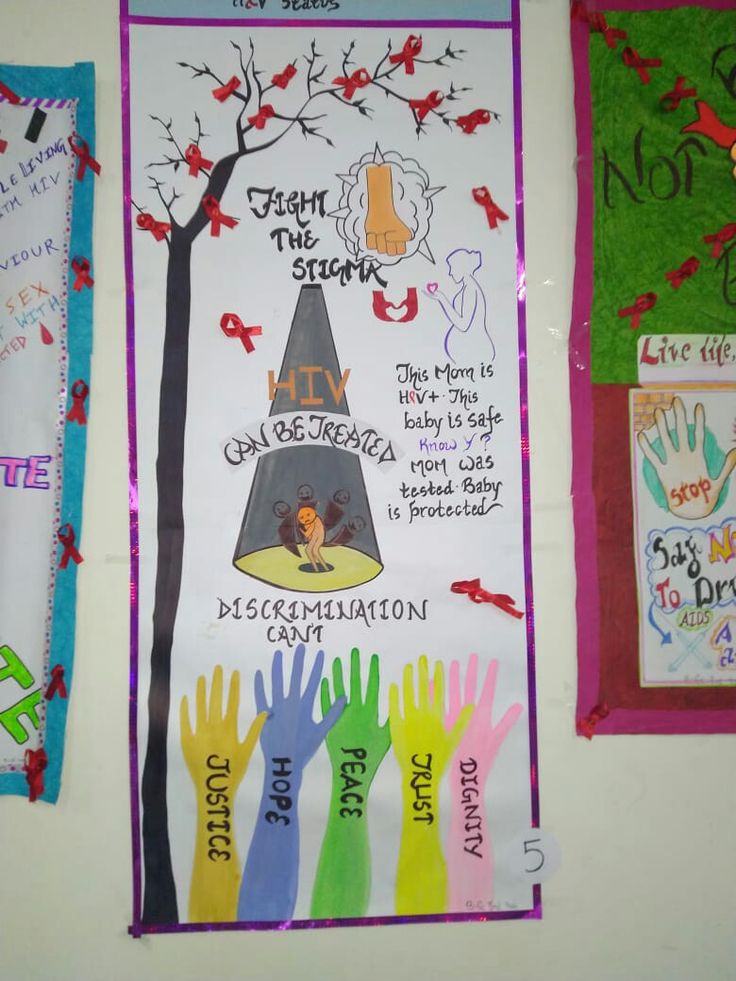 a bulletin board with handprints on it and other colorful papers attached to the wall