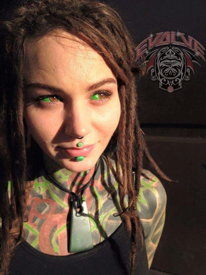 a woman with dread locks and green eyes