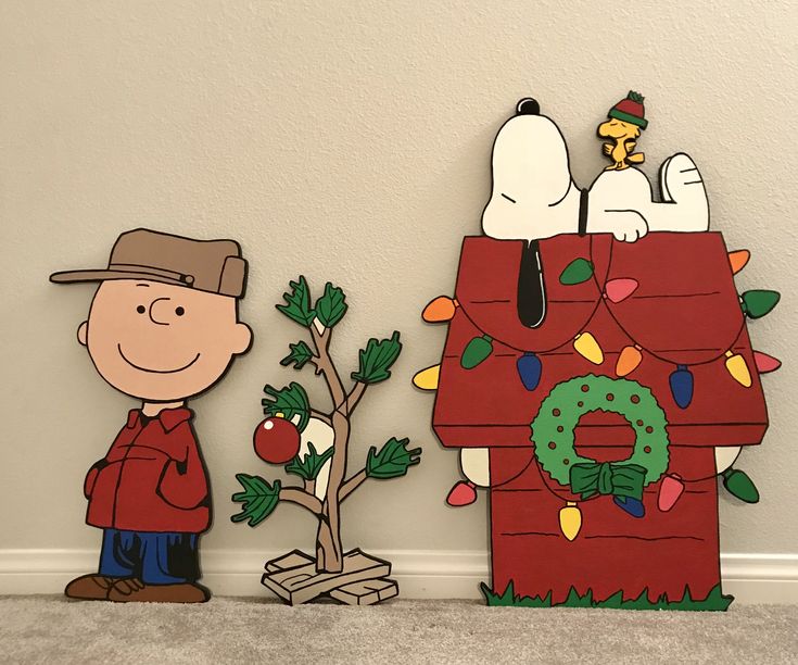 a charlie brown christmas scene with peanuts and his doghouse made out of cardboard paper