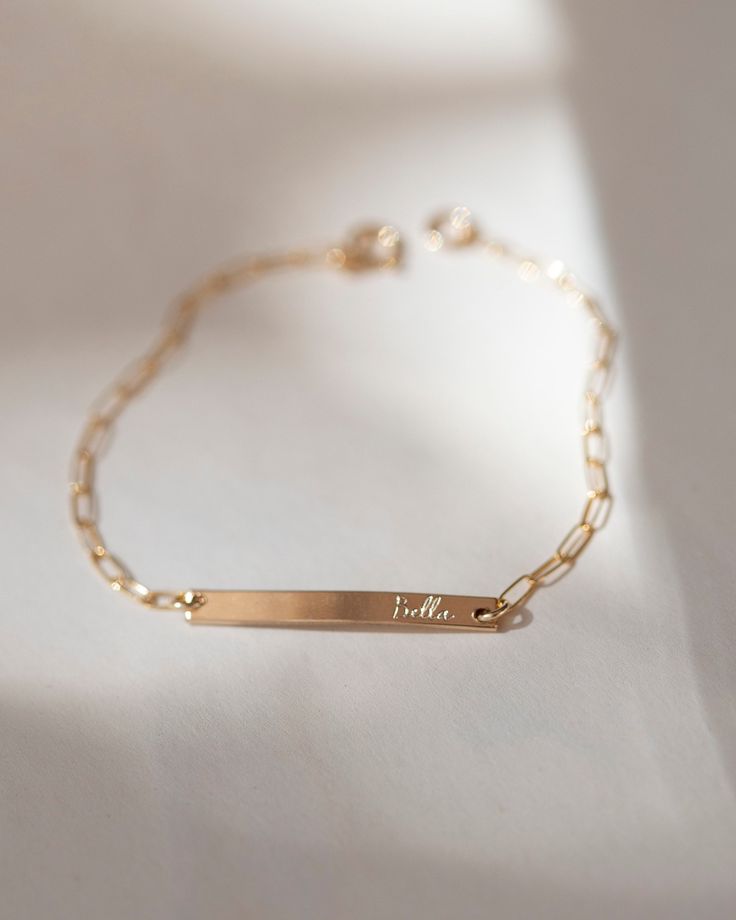 Personalized this bracelet with any special date, name or word. On a dainty paperclip chain this bracelet is THE perfect meaningful gift for that special someone. * 14k gold fill or sterling silver * Bar measures 3x30mm * leave us your personalization request while check out Bar Bracelet Personalized, Bar Bracelet, Silver Bar, Meaningful Jewelry, Silver Christmas, Roman Numeral, Bar Bracelets, Name Bracelet, Trombone