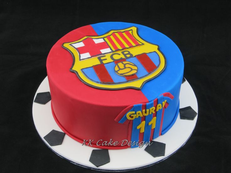 a birthday cake with the emblem of barcelona on it