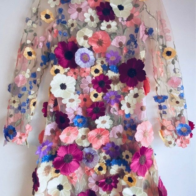 Fixed width is 47 inches, I am selling this in one yard . If you need more, please convo me. PLEASE NOTE OUR LAST PICTURE WITH THE FINISHED DRESS IS FROM MY CLIENT JOANNA, thank you so much for sharing such beautiful picture with us ！！！ HERE IS THE LINK FOR off white: https://www.etsy.com/listing/493916639/embroidered-tulle-lace-fabric-multi **this fabric is the best seller in my shop, there are many versions in this market with similar design , but totally different quality. this delicate quali Taylor Swift Flower Dress, Summer Tulle Fabric With Floral Embroidery, Spring Lace Tulle Fabric With 3d Embroidery, Spring Tulle Fabric With Floral Lace Embroidery, Luxury Floral Embroidered Organza Tulle Fabric, Luxury Floral Embroidered Tulle Fabric, White Lace Fabric, Beaded Lace Fabric, Amazing Lace