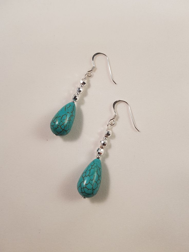 Not only do I love the Turquoise gemstone, I also love the sterling silver faceted beads. - Turquoise Teardrop Beads - Sterling Silver Faceted Round Bead - Sterling Silver Beads - Sterling Silver Hook Earrings Turquoise promotes spiritual attunement and aids communication. Turquoise Teardrop Beaded Earrings, Turquoise Teardrop Faceted Beads Jewelry, Turquoise Faceted Drop Earrings, Turquoise Faceted Teardrop Earrings, Turquoise Teardrop Faceted Earrings, Faceted Turquoise Teardrop Earrings, Turquoise Teardrop Earrings With Faceted Beads, Handmade Turquoise Teardrop Earrings With Round Beads, Turquoise Teardrop Faceted Jewelry