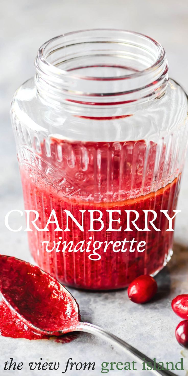 cranberry vinaigreate recipe in a jar with spoon