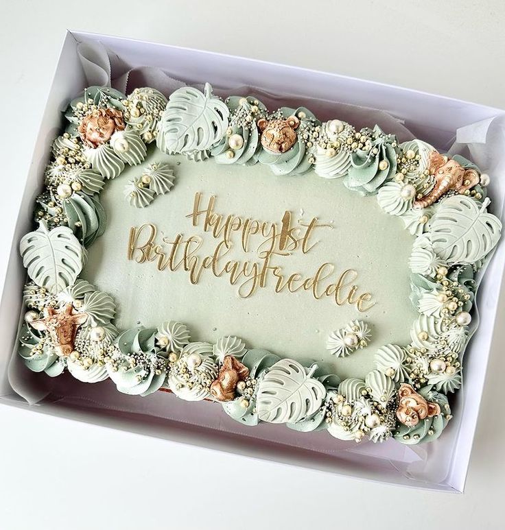 a birthday cake in a box with the words happy birthday written on it