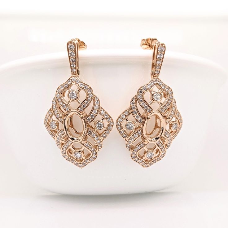 A gorgeous semi mount design for a set of statement earrings with an intricate design and beautiful natural diamond accents! These earrings are complete with pushback closures for comfortable and secure wear.  Specifications: Item Type: Earrings Semi Mount Head size: 10x7mm Shape: Oval Metal: 14k/11.09g Diamond Clarity/Color: SI / G-H Diamond Count/Weight: 170/1.68 cttw SKU: AJE243/7866 These earrings semi mounts are made with solid 14k Gold and natural earth mined SI / G-H Diamonds. FREE SHIPPI Luxury Oval Bridal Earrings With Prong Setting, Exquisite Diamond Earrings With Intricate Design For Formal Occasions, Exquisite Oval Diamond Earrings With Accents, Exquisite Oval Earrings With Prong Setting, Oval Earrings With Pave Setting For Wedding, Exquisite Oval Prong-set Earrings, Exquisite Oval Prong Set Earrings, Oval Diamond Earrings With Elegant Design For Formal Occasions, Elegant Oval Diamond Earrings For Formal Occasions