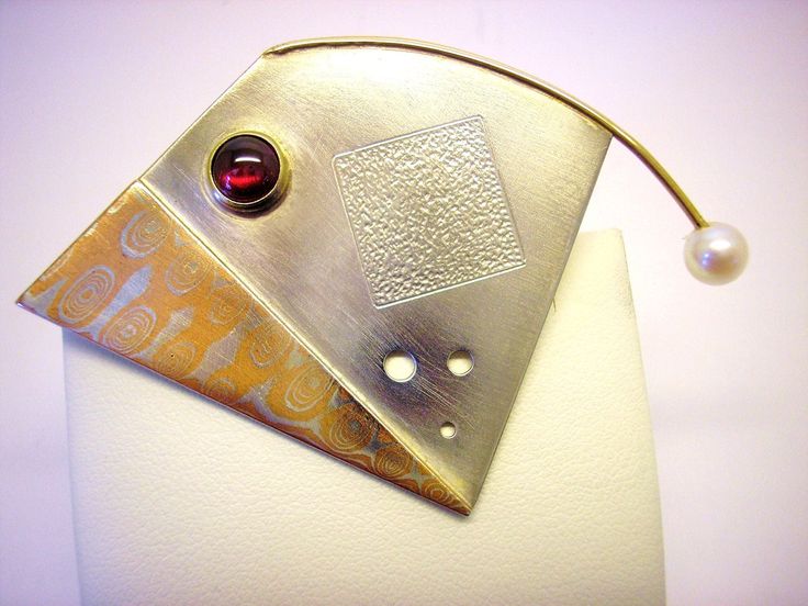 This is an geometric & abstract pin/brooch made of Sterling Silver, 14K YG, and Copper/Sterling Mokume Gane.  The pin features a bezel-set Garnet cabochon and a 5.5mm cultured Akoya pearl.  The pin-stem & catch are 14K as well as the bezel and wire holding the pearl. Sweet Earrings, Mokume Gane, Silver Jewelry Design, Akoya Pearls, Silver Diamonds, Fine Silver, Diamond Pendant, Metal Working, Brooch Pin