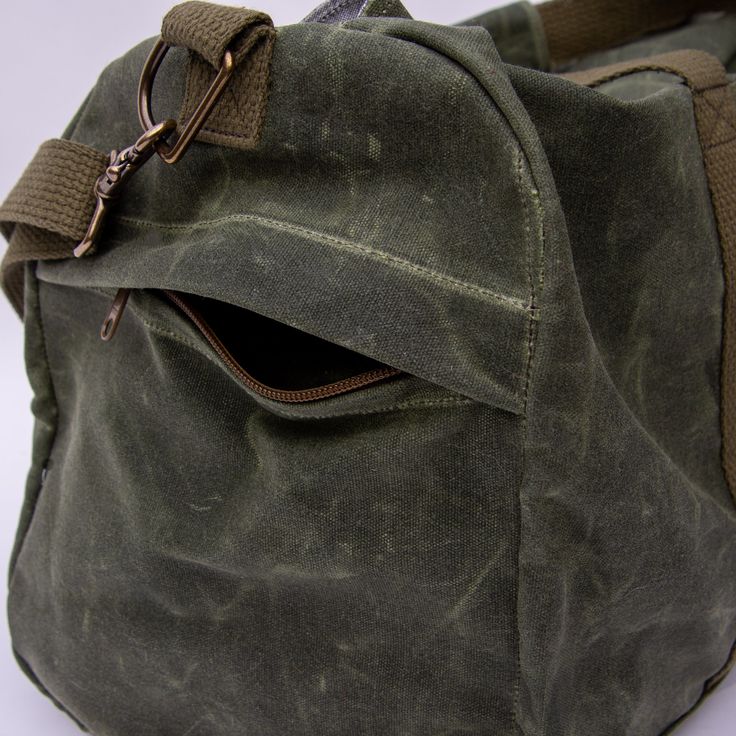 This is a listing for an OLIVE duffle with OLIVE webbing. Photos of duffles with other color combos are for reference onlyThis duffle is as large as it can be while still being acceptable as carry-on luggage. Suitable not only for air travel, it can also be used for car travel, field work, or a bug out emergency bag, to name a few. You can pack this bag full, head out for your next adventure and the chunky #10 zipper will not burst under strain. Snap the zipper protection flap in place to protect your belongings inside from whatever weather you may need to run through. The 1 ½’’ wide cotton webbing goes all the way around the bag to give support to your heaviest loads while the double layer bottom gives you extra protection against abrasive surfaces. Two exterior pockets help keep smaller Field Work, Emergency Bag, A Bug, Air Travel, Carry On Luggage, Car Travel, Color Combos, Double Layer, Carry On