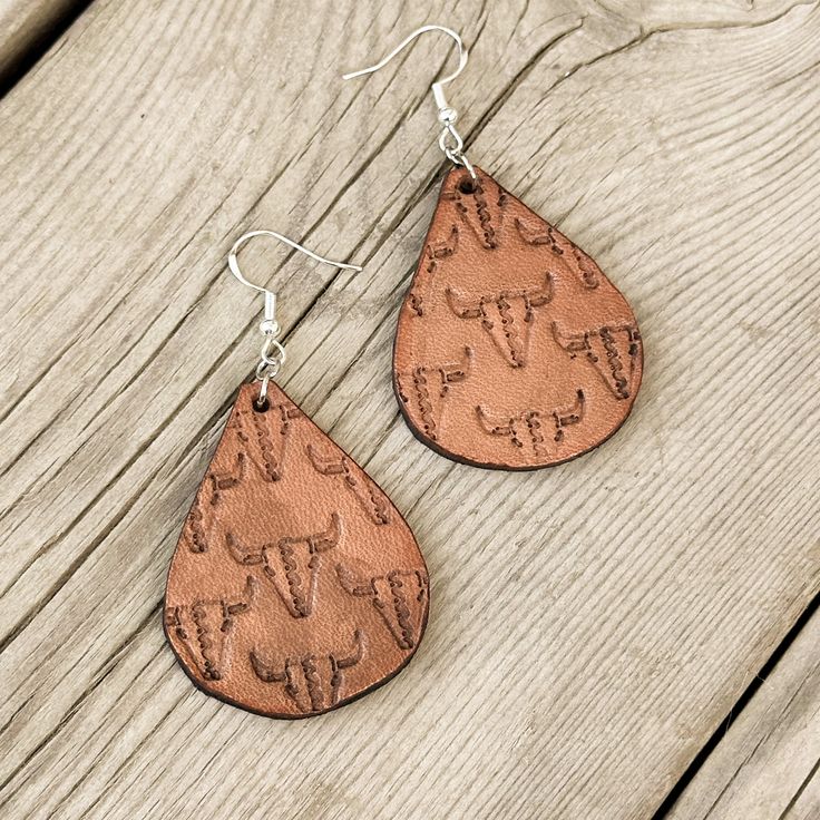 Earrings are lightweight and hand tooled from scratch. Finished product may vary slightly from the picture due to its handmade nature. Earrings are finished with silver earring hooks for easy wearing. Artisan Hand-tooled Teardrop Earrings, Unique Hand-tooled Teardrop Earrings, Rustic Handmade Teardrop Earrings, Artisan Etched Drop Earrings, Hand Tooled Teardrop Earrings For Gift, Adjustable Hand Tooled Drop Earrings, Rustic Everyday Earrings, Rustic Drop Earrings With Ear Wire, Artisan Etched Dangle Earrings