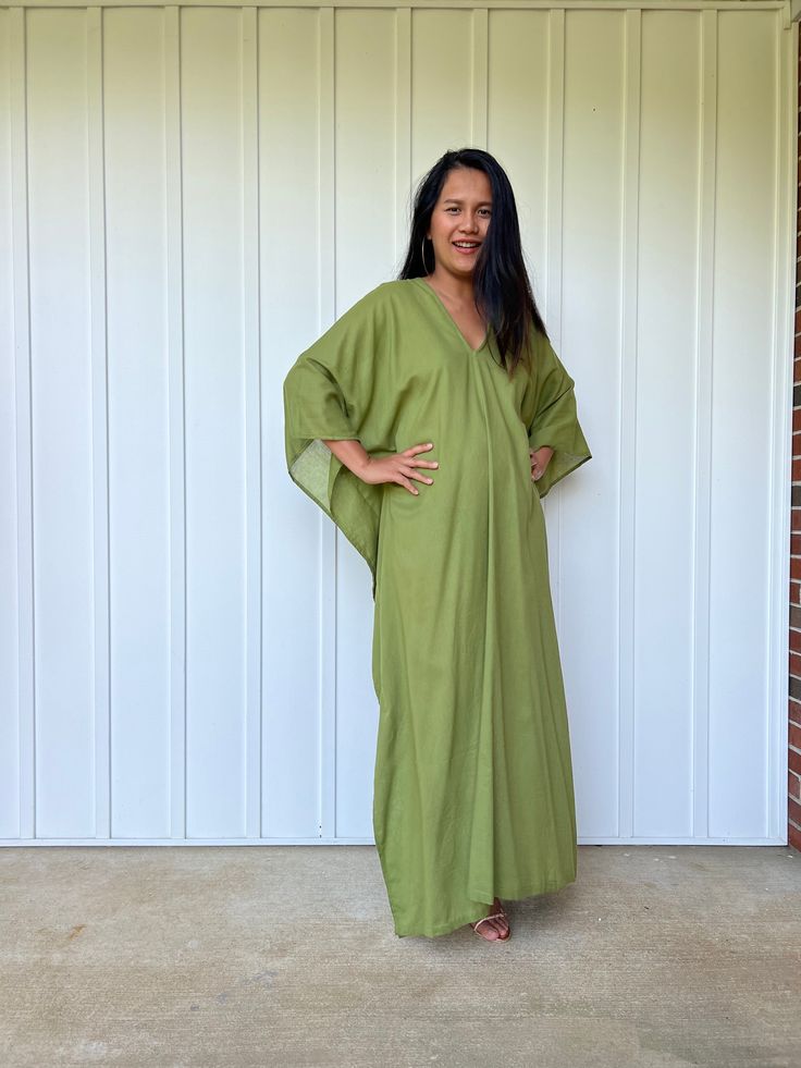 Unwind in absolute comfort with our semi sheer cotton gauze kaftan. This kaftan is perfect for the beach, pool, resort and laid-back time at home. Crafted from quality soft and breathable gauze cotton, it offers an airy fit that's ideal for lounging and cover up. Its relaxed design and easy slip-on style make it your go-to choice for outdoor cover up and relaxed nights at home. Green V-neck Tunic For Beach, Green Relaxed Fit Beach Tunic, Casual Linen V-neck Kaftan, Green Bohemian Kaftan With Relaxed Fit, Green Free Size Kaftan For Loungewear, Green Bohemian Relaxed Fit Kaftan, Green V-neck Tunic For The Beach, Green Flowy Tunic Cover-up, Green V-neck Beach Tunic