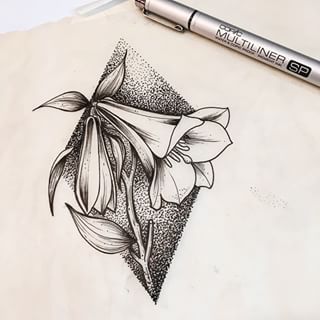 a pencil drawing of a flower on top of a piece of paper next to a marker